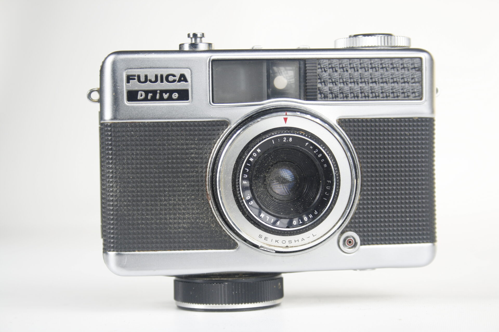 Fuji Fujica Drive half-frame viewfinder camera. 35mm film. 1964. Japan.